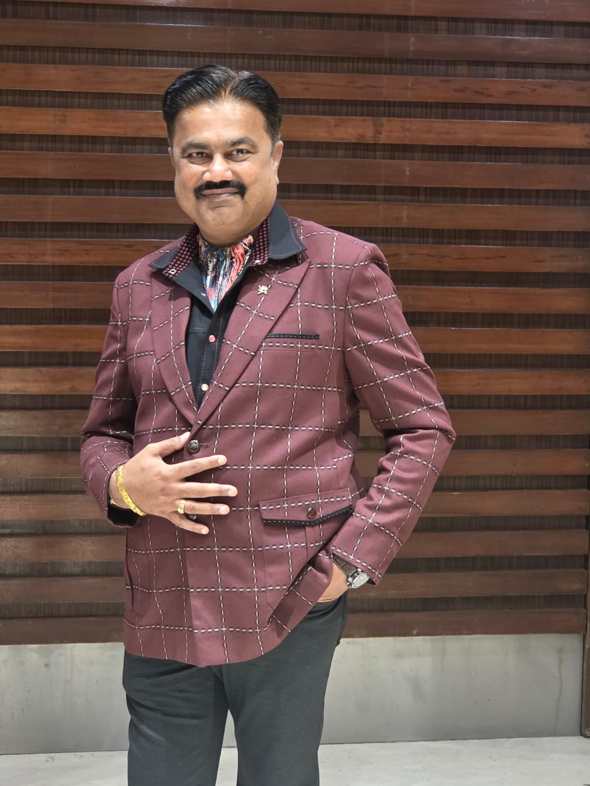 Elevate your occasion wear with this luxurious maroon checked blazer—where classic tailoring meets modern elegance."